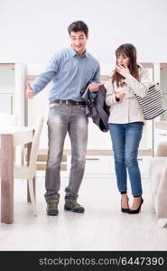 Married couple in the shop choosing furniture