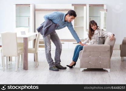 Married couple in the shop choosing furniture