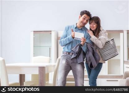 Married couple in the shop choosing furniture