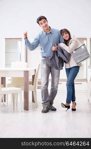 Married couple in the shop choosing furniture