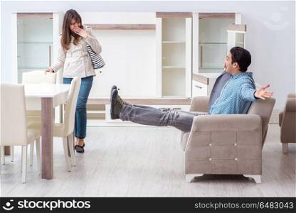 Married couple in the shop choosing furniture