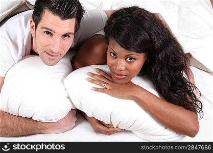 Married couple lying in bed