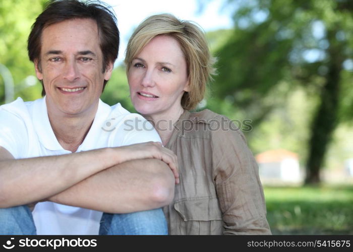 Married couple sat in the park