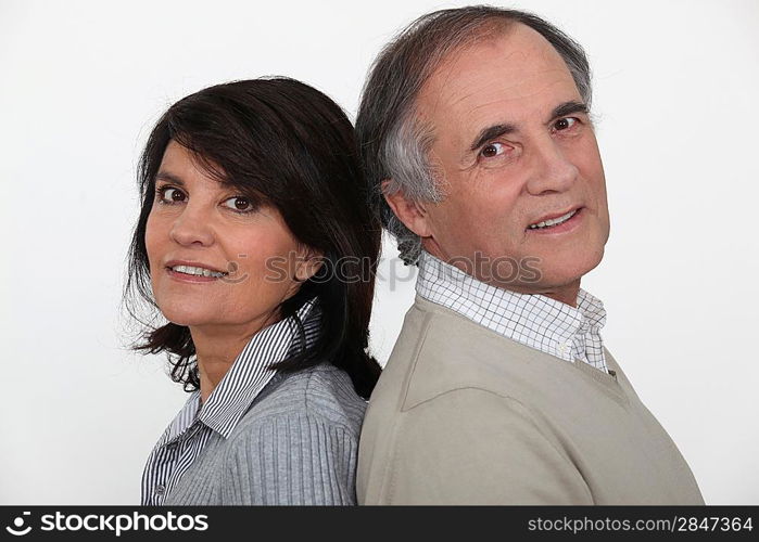 Married couple stood back to back