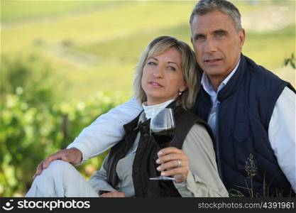 Married couple tasting wine