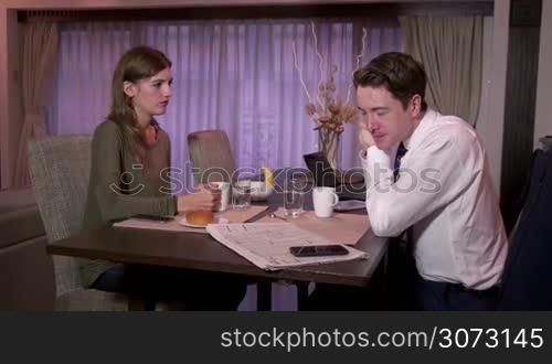 Married people, marriage relationship, modern life, husband and wife at home, man and woman having breakfast. Busy businessman with newspaper for stocks talking to partner, smiling and drinking coffee