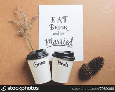 Married quote on paper with coffee cup groom and bride for wedding idea