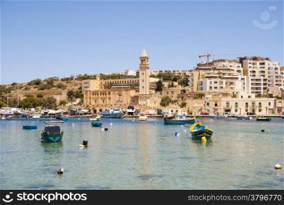 Marsaskala city and bay with typical boats, Malta