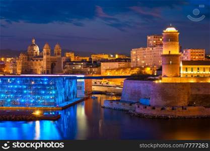 Marseille Old Port and Fort Saint-Jean and Museum of European and Mediterranean Civilisations and Marseille Cathedral illumintaed in night. Marseille, France. Marseille, France. Horizontal camera pan. Marseille Old Port and Fort Saint-Jean in night. France