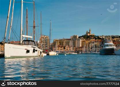 Marseille Old Port (Vieux-Port de Marseille) with yachts and Basilica of Notre-Dame de la Garde. Marseille, France. Marseille Old Port with yachts. Marseille, France