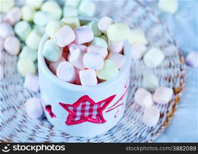 marshmallow in bowl and on a table