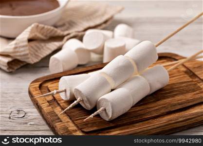 marshmallow on old wooden table. marshmallow on table