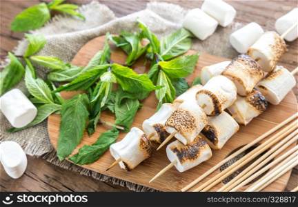 Marshmallow skewers on the wooden board