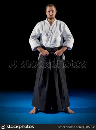 Martial arts fighter isolated on black