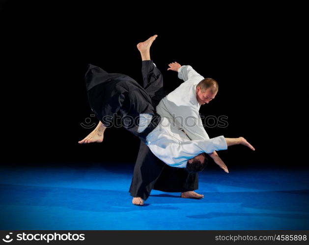 Martial arts fighters isolated on black