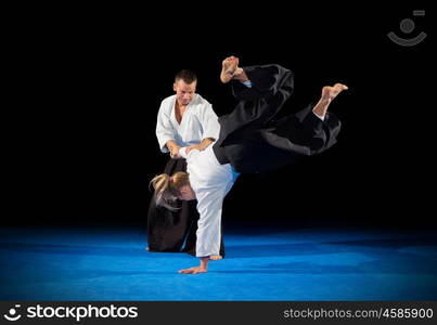 Martial arts fighters isolated on black