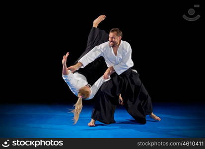 Martial arts fighters isolated on black