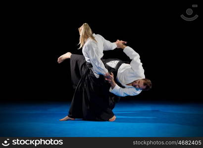 Martial arts fighters isolated on black