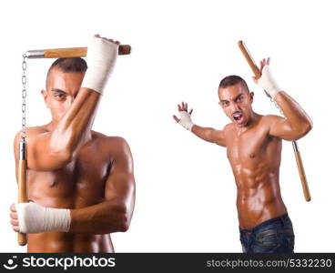 Martial arts warrior with nunchucks on white