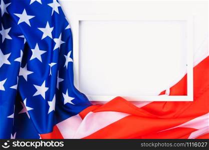 Martin luther king day, flat lay top view, American flag and photo frame on white background with copy space for your text