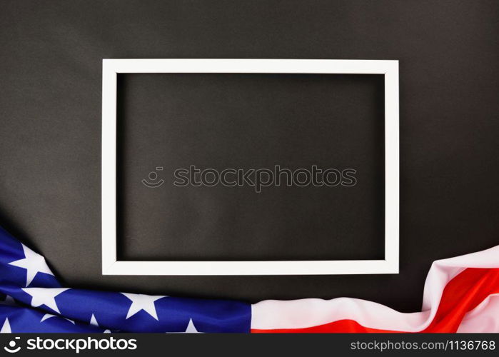 Martin luther king day, flat lay top view, American flag and photo frame on black background with copy space for your text