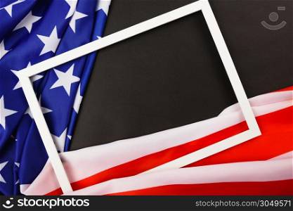 Martin luther king day, flat lay top view, American flag and photo frame on black background with copy space for your text