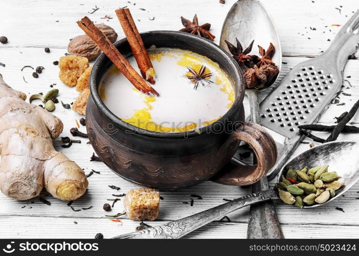 Masala tea in clay mug. indian Masala tea in clay cup with spices on light background