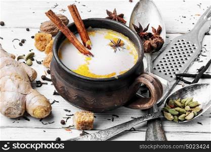 Masala tea in clay mug. indian Masala tea in clay cup with spices on light background