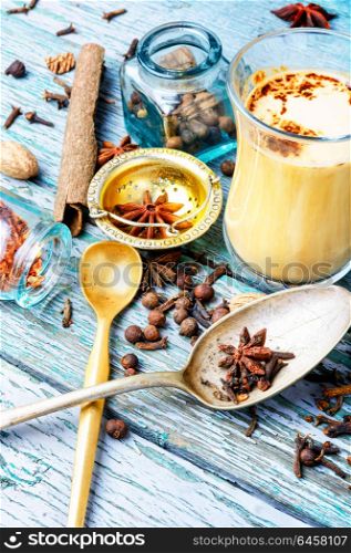 Masala tea with spices. Glass cup of traditional indian masala tea.Masala chai