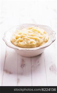 Mashed potato in a bowl on the table. The mashed potato