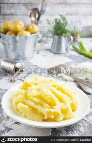 mashed potato with butter in white bowl