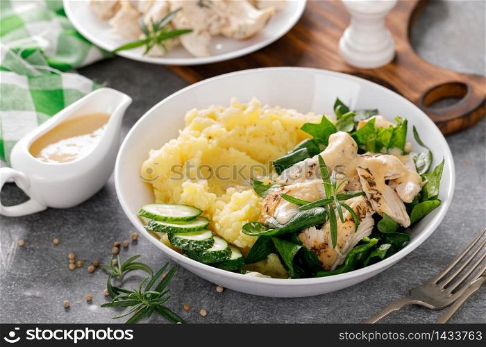 Mashed potato with grilled chicken and spinach salad