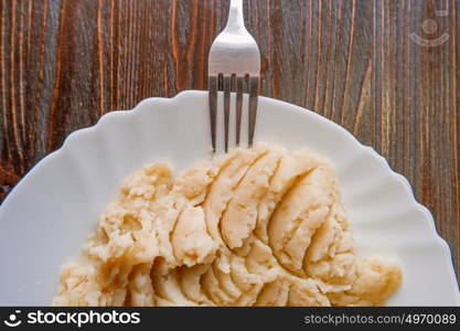 Mashep potatoes top view with fork