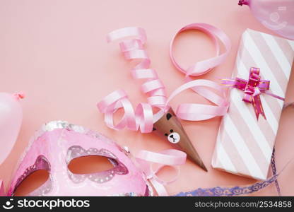 mask near ribbon gift box