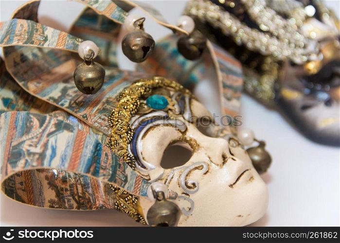 masks and feathers of venice carnival on white background