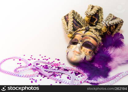 masks and feathers of venice carnival on white background