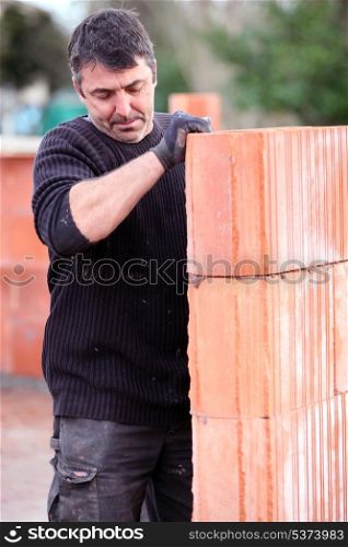 Mason building a wall
