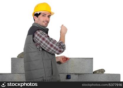 mason building a wall