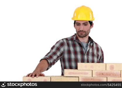 mason erecting a wall
