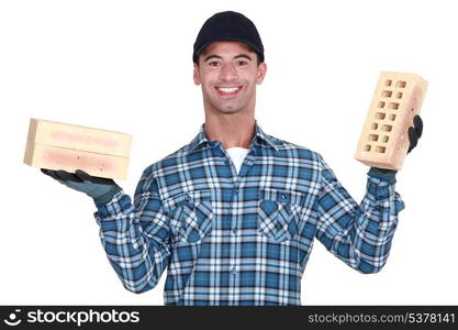 Mason holding a brick