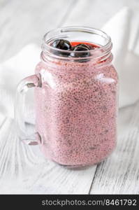 Mason jar of cherry chia pudding close up