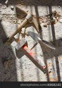 Mason tools on debris background in house improvement construction
