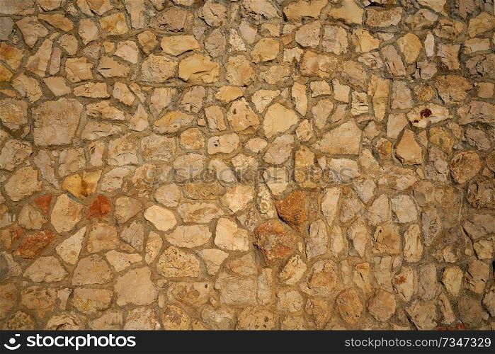 Masonry wall stonewall in Mediterranean background