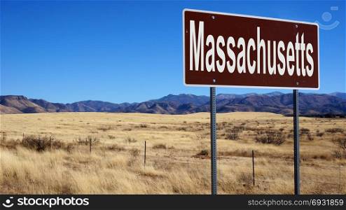 Massachusetts road sign with blue sky and wilderness