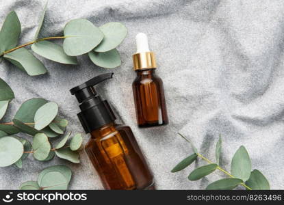 Massage and Spa products with eucalyptus on a textile fabric background