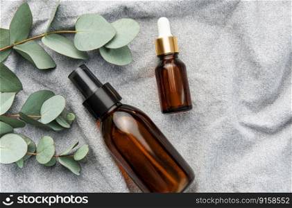 Massage and Spa products with eucalyptus on a textile fabric background