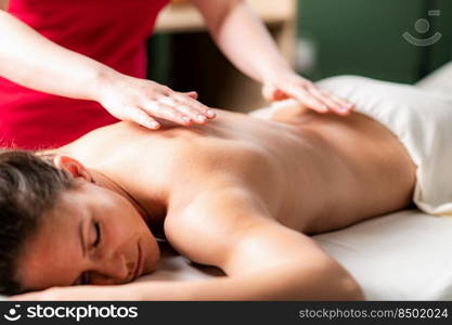 Massage for stress and tension relief. Female massage therapist massaging a woman 