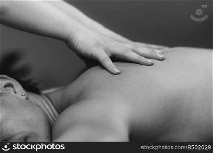 Massage for stress and tension relief. Female massage therapist massaging a woman 