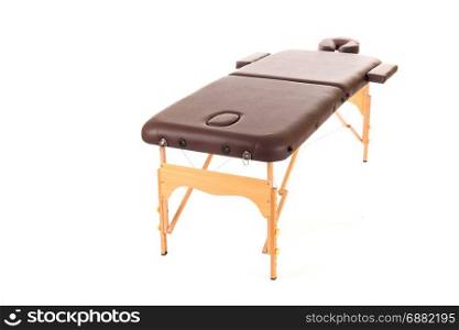 Massage Table from leather and wood isolated on a white background
