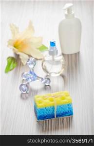 massager bottles sponge soap and flower